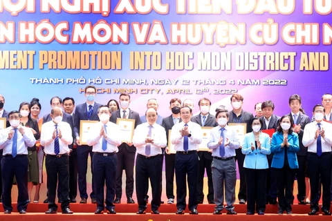 Hội nghị xúc tiến đầu tư vào huyện Hóc Môn và Củ Chi (TP.HCM) nhân chuyến công tác của Chủ tịch nước Nguyễn Xuân Phúc tiếp tục thu hút đóng góp của các doanh nghiệp trong và ngoài nước. (Ảnh: Vietnam+)