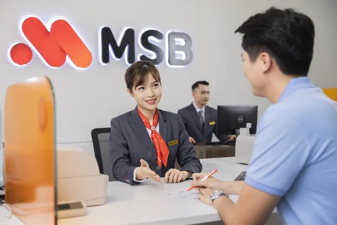 Giao dịch tại Ngân hàng MSB. (Ảnh: PV/Vietnam+)