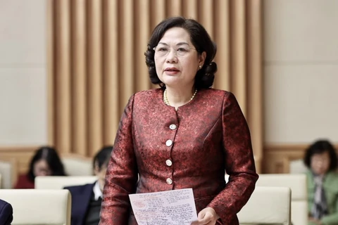 Thống đốc Ngân hàng Nhà nước Nguyễn Thị Hồng báo cáo tại Hội nghị. (Ảnh: PV/Vietnam+) 