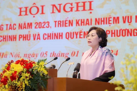 Thống đốc Nguyên Thị Hồng phát biểu tham luận tại Hội nghị. (Ảnh: CTV/Vietnam+)