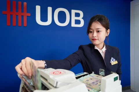 UOB dự báo tỷ giá có thể sẽ duy trì ở mức cao trong thời gian dài hơn. (Ảnh: Vietnam+)