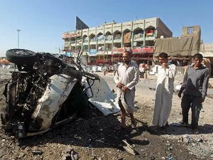 Hiện trường vụ đánh bom xe ở Baghda. (Ảnh: AFP/TTXVN)