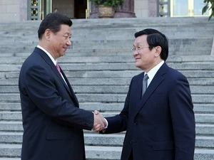 Chủ tịch nước Cộng hòa Nhân dân Trung Hoa Tập Cận Bình đón Chủ tịch nước Trương Tấn Sang. (Ảnh: Nguyễn Khang/TTXVN)
