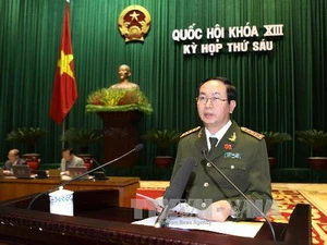 Bộ trưởng Bộ Công an Trần Đại Quang trình bày báo cáo về công tác phòng, chống tội phạm trước Quốc hội. (Nguồn: TTXVN)