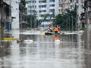 Ngập lụt tại thị trấn Baisha, thành phố Trùng Khánh, Trung Quốc ngày 23/7. (Nguồn: THX/TTXVN)