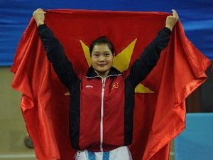 Niềm vui của võ sỹ Lê Bích Phương đoạt huy chương vàng tại ASIAD lần thứ 16. (Nguồn: AFP/TTXVN)