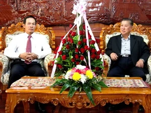 Bộ trưởng Vilayvanh Phomkhe tiếp tổng giám đốc Trần NgọcThuận. (Ảnh: Hoàng Chương/Vietnam+)