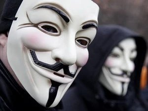 Những kẻ đeo mặt nạ ủng hộ nhóm Anonymous (Nguồn: Reuters)