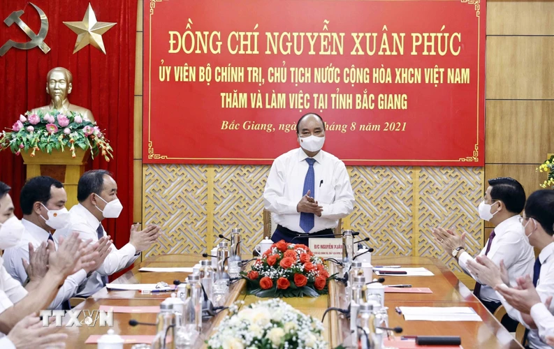 Chủ tịch nước Nguyễn Xuân Phúc tại buổi làm việc. (Ảnh: Thống Nhất/TTXVN)
