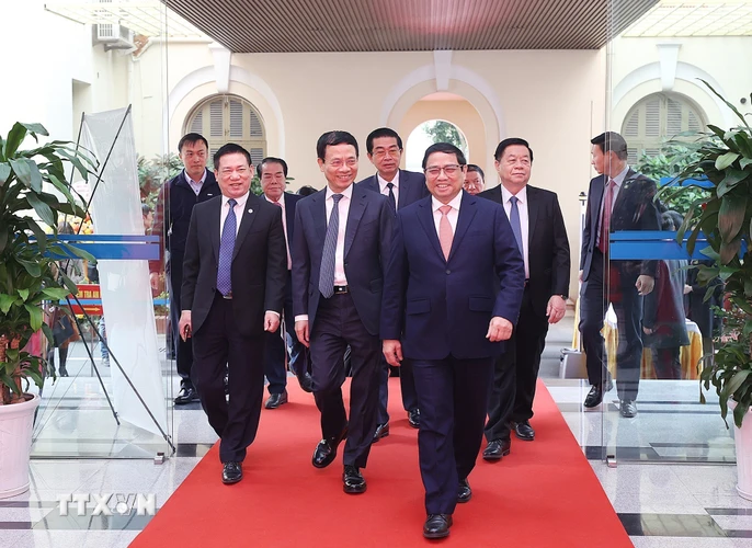 Thủ tướng Phạm Minh Chính dự Hội nghị tổng kết công tác năm 2022 và triển khai nhiệm vụ năm 2023 của Bộ Thông tin và Truyền thông và Lễ đón nhận Huân chương Lao động hạng Nhất. (Ảnh: Dương Giang/TTXVN)