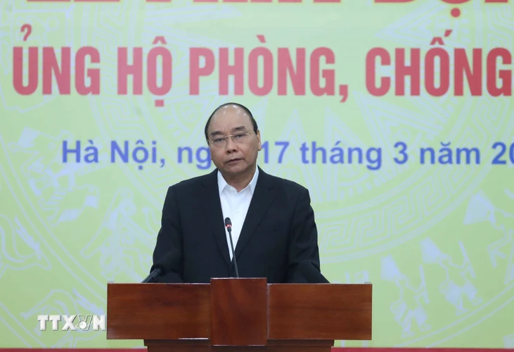 Thủ tướng Nguyễn Xuân Phúc phát biểu tại Lễ phát động toàn dân ủng hộ phòng, chống dịch COVID-19. (Ảnh: Thống Nhất/TTXVN)