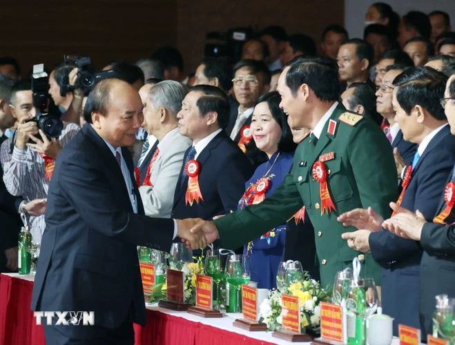 Thủ tướng Nguyễn Xuân Phúc đến dự lễ kỷ niệm 90 năm Ngày thành lập Hội Nông dân Việt Nam. (Ảnh: Thống Nhất/TTXVN)
