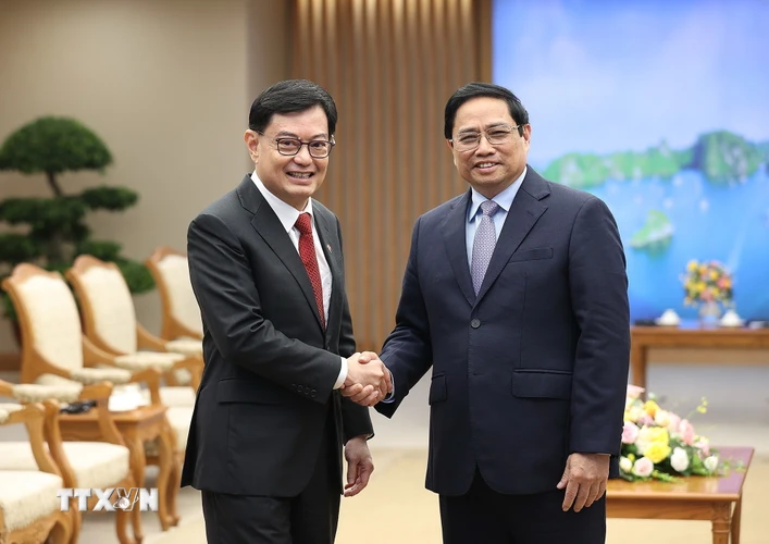 Thủ tướng Phạm Minh Chính tiếp Phó Thủ tướng, Bộ trưởng Điều phối Chính sách Kinh tế Singapore Heng Swee Keat đang thăm và làm việc tại Việt Nam. (Ảnh: Dương Giang/TTXVN)