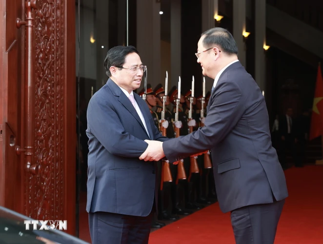 Thủ tướng Phạm Minh Chính hội kiến Thủ tướng Lào Sonexay Siphandone. (Ảnh: Dương Giang/TTXVN)