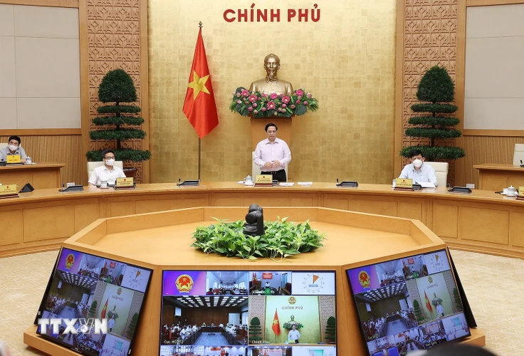  Thủ tướng Phạm Minh Chính chủ trì cuộc họp trực tuyến với lãnh đạo tỉnh Kiên Giang và Tiền Giang. (Ảnh: Dương Giang/TTXVN)