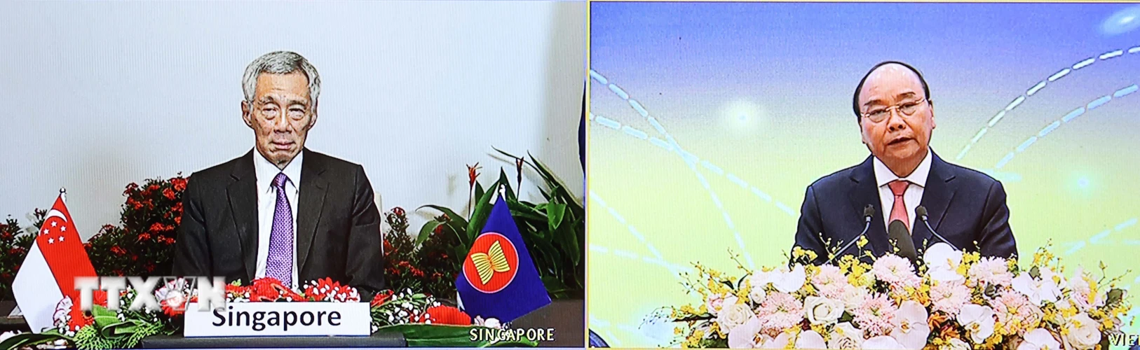 Thủ tướng Nguyễn Xuân Phúc và Thủ tướng Singapore Lý Hiển Long dự Lễ khởi động Mạng lưới Logistics thông minh ASEAN - ASLN theo hình thức trực tuyến. (Ảnh: Thống Nhất/TTXVN)