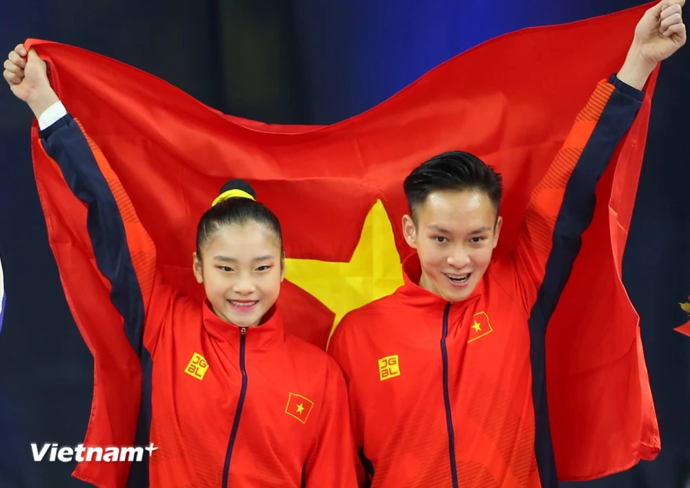 Phan Thế Gia Hiển-Bùi Minh Phương giúp Aerobic lập hat-trick huy chương Vàng. (Ảnh: Vietnam+)