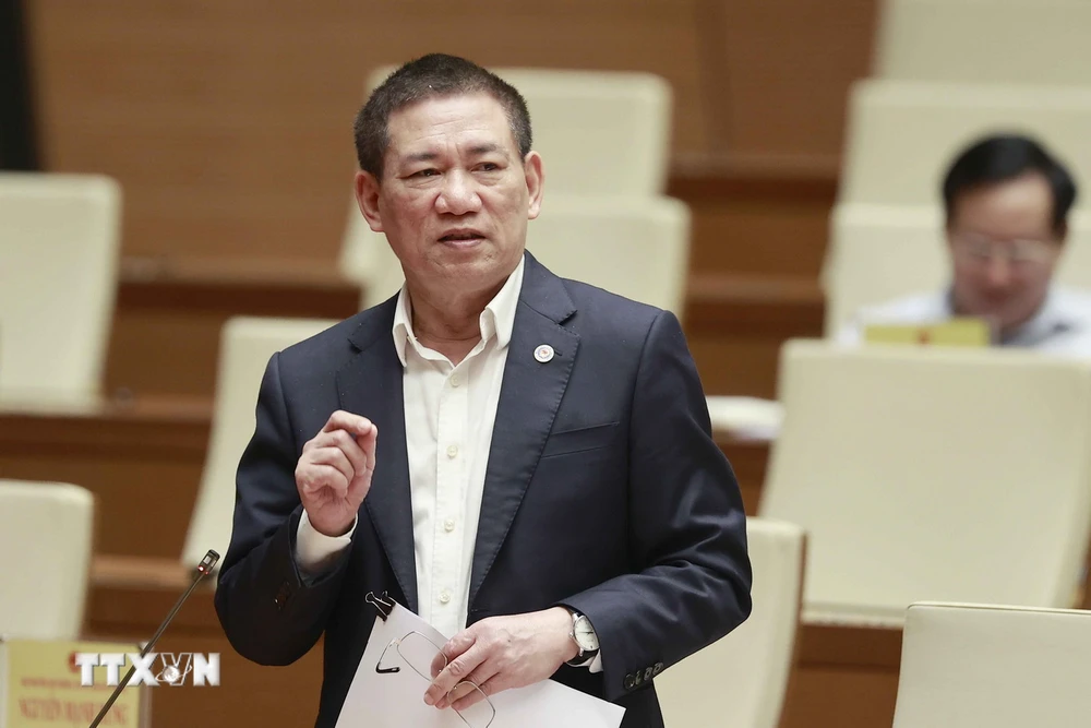 Bộ trưởng Bộ Tài chính Hồ Đức Phớc phát biểu tại phiên họp Hội nghị đại biểu Quốc hội hoạt động chuyên trách. (Ảnh: Doãn Tấn/TTXVN)