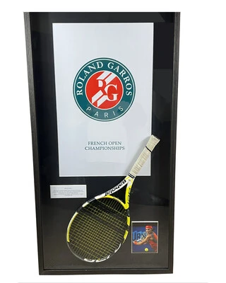 Rafael Nadal's championship point winning racket from his 2007 French Open Final victory over Roger Federer, in custom framing. The racket comes with a Resolution Photomatch document, forensically confirming it was the very racket which won the final point.