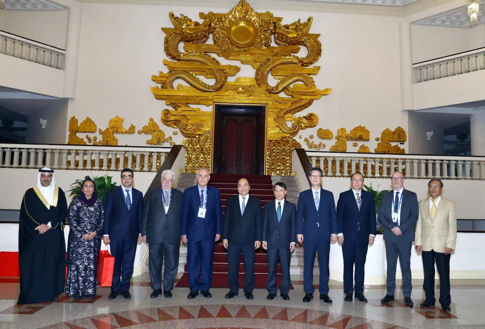 Thủ tướng Nguyễn Xuân Phúc và các Trưởng đoàn tại buổi tiếp. (Ảnh: Thống Nhất/TTXVN)