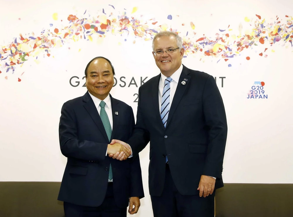 Thủ tướng Nguyễn Xuân Phúc gặp Thủ tướng Australia Scott Morrison nhân chuyến tham dự Hội nghị cấp cao G20 tại Nhật Bản vào tháng 6/2019. (Ảnh: Thống Nhất/TTXVN)