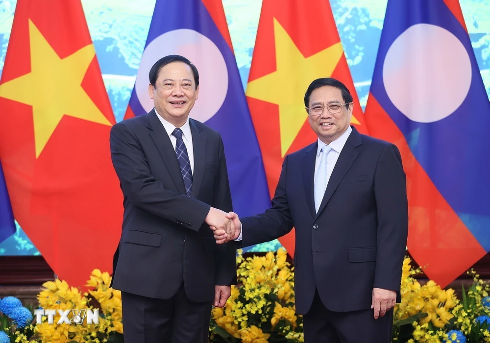Thủ tướng Phạm Minh Ch&iacute;nh v&agrave; Thủ tướng L&agrave;o Sonexay Siphandone. (Ảnh: Dương Giang/TTXVN)
