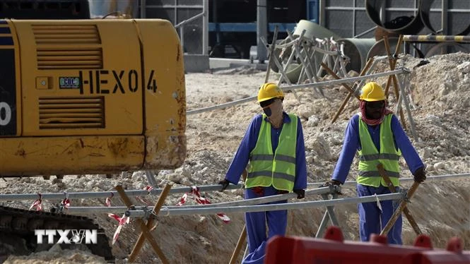 Công nhân làm việc tại một công trường xây dựng. (Ảnh minh họa. AFP/TTXVN)