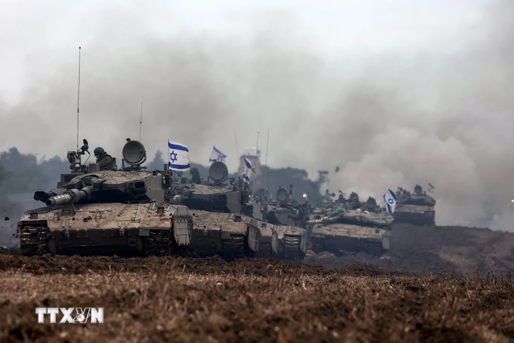Binh sĩ Israel trở về phần lãnh thổ của Nhà nước Do Thái, giáp giới Dải Gaza ngày 28/1/2024. (Ảnh: AFP/TTXVN)