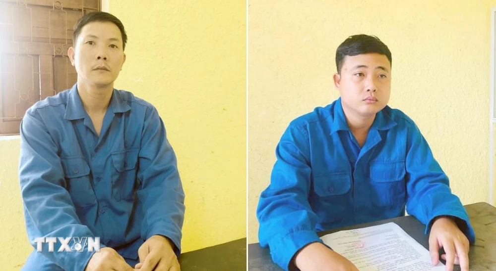 Đối tượng Nguyễn Mậu Văn (trái) và Huỳnh Chí Linh bị bắt tạm giam. (Ảnh: TTXVN phát)