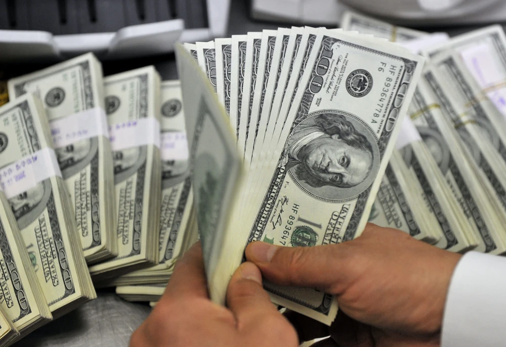Đồng USD (Ảnh: AFP/TTXVN)