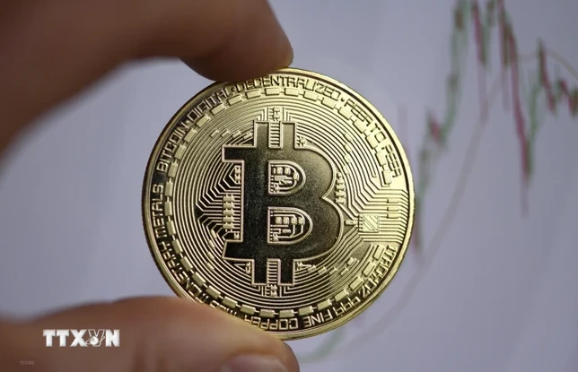 Đồng tiền kỹ thuật số Bitcoin. (Ảnh: AFP/TTXVN) 