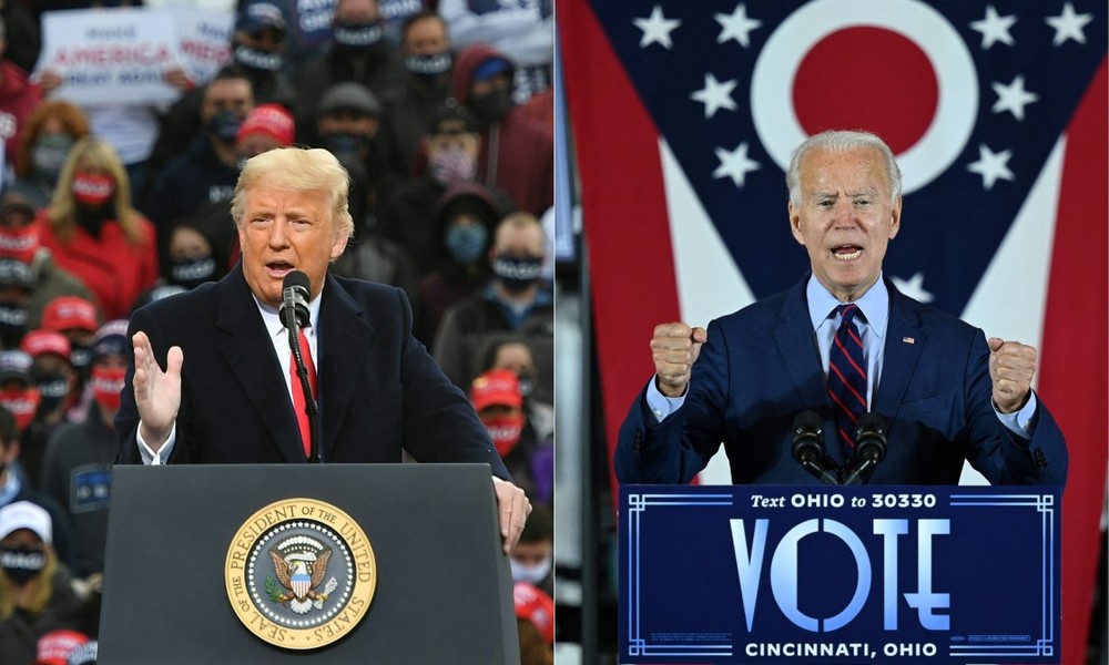 Tổng thống Mỹ Joe Biden (phải) và cựu Tổng thống Donald Trump. (Ảnh: AFP/TTXVN)