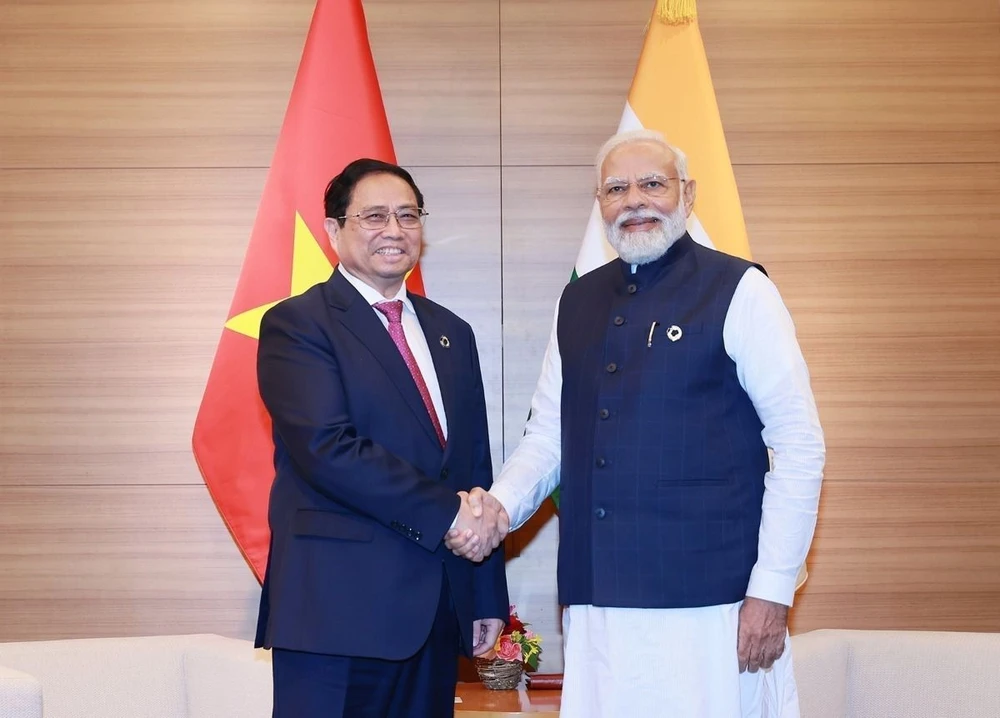 Thủ tướng Phạm Minh Chính gặp Thủ tướng Ấn Độ Narendra Modi tại Hội nghị thượng đỉnh Nhóm Các nước Công nghiệp Phát triển (G7) Mở rộng ở Hiroshima (Nhật Bản), ngày 20/5/2023. (Ảnh: Dương Giang/TTXVN)