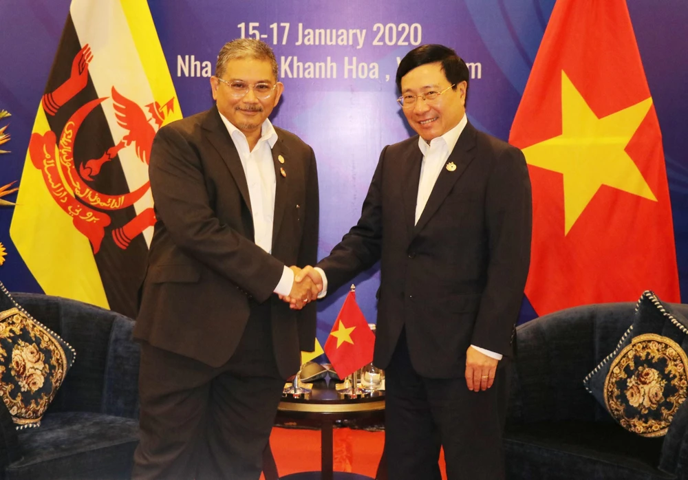 Phó Thủ tướng, Bộ trưởng Ngoại giao Phạm Bình Minh tiếp Bộ trưởng thứ hai Bộ Ngoại giao Brunei Darussalam Dato Erywan Pehin Yusof. (Ảnh: Tiên Minh/TTXVN)