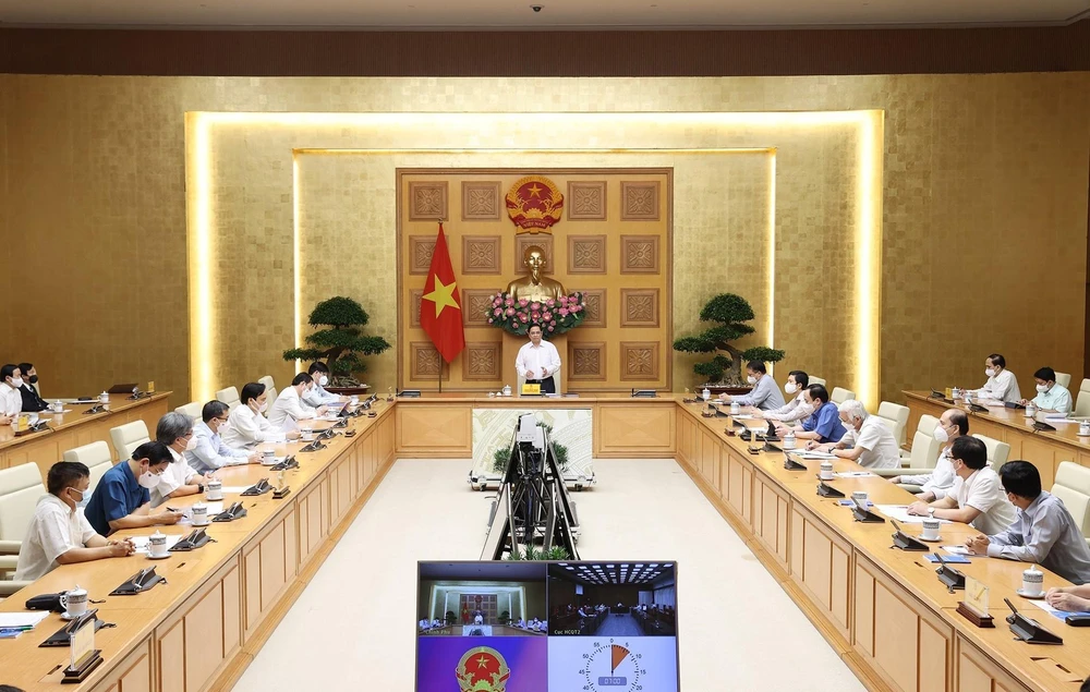 Thủ tướng Phạm Minh Chính gặp gỡ bác sỹ, nhà khoa học, nhà giáo trong lĩnh vực y tế (Ảnh: Dương Giang/TTXVN)