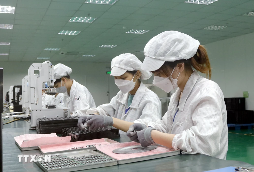 Người lao động trở lại làm việc tại doanh nghiệp trong Khu công nghiệp của Bắc Giang sau kỳ nghỉ Tết. (Ảnh: Đồng Thúy/TTXVN)