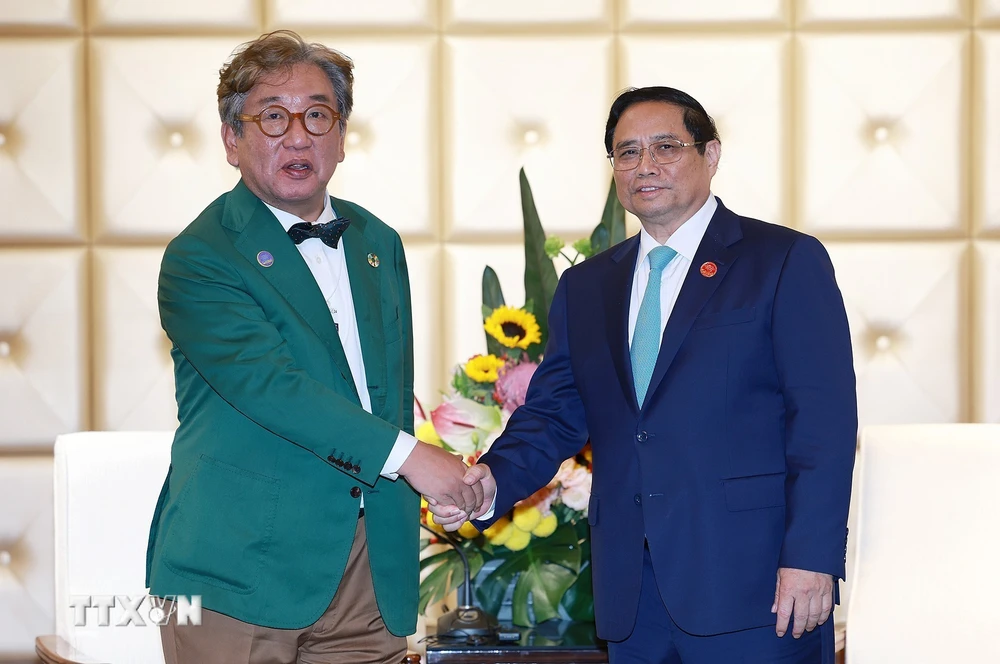 Thủ tướng Phạm Minh Chính tiếp Chủ tịch Ủy ban về Trung hoà Carbon và Tăng trưởng xanh Hàn Quốc Kim Sang-hyup. (Ảnh: Dương Giang/TTXVN)