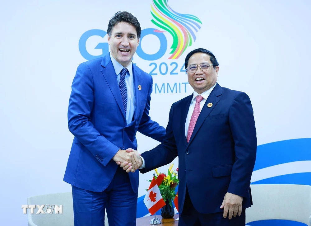 Thủ tướng Phạm Minh Chính gặp Thủ tướng Canada Justin Trudeau. (Ảnh: Dương Giang/TTXVN)