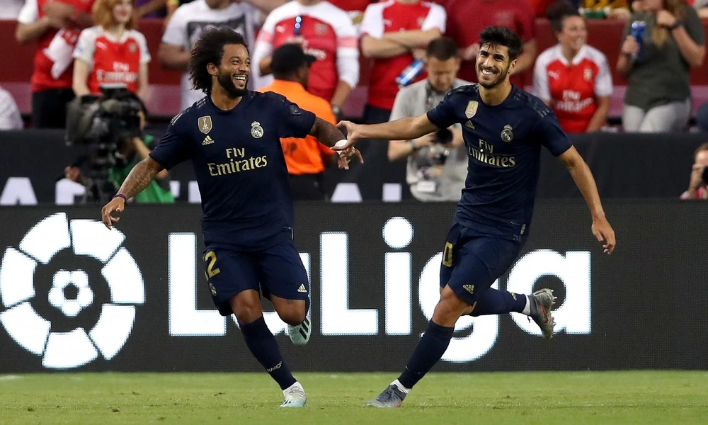 Asensio và Marcelo ăn mừng sau pha phối hợp ghi bàn đẹp mắt. (Nguồn: Getty Images)