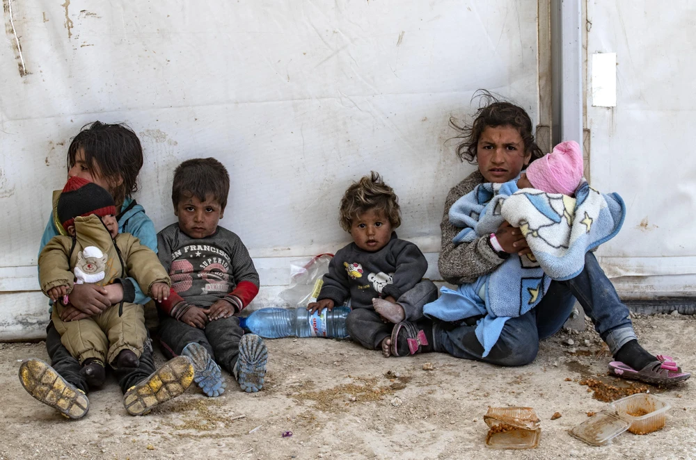 Người tị nạn tại một trại tạm ở tỉnh Hasakeh, Đông Bắc Syria ngày 18/3. (Ảnh: AFP/TTXVN)