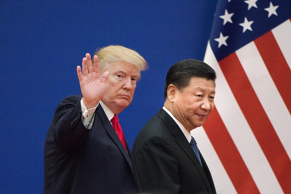 Tổng thống Mỹ Donald Trump (trái) trong cuộc gặp Chủ tịch Trung Quốc Tập Cận Bình tại Bắc Kinh ngày 9/11/2017. (Ảnh: AFP/TTXVN)