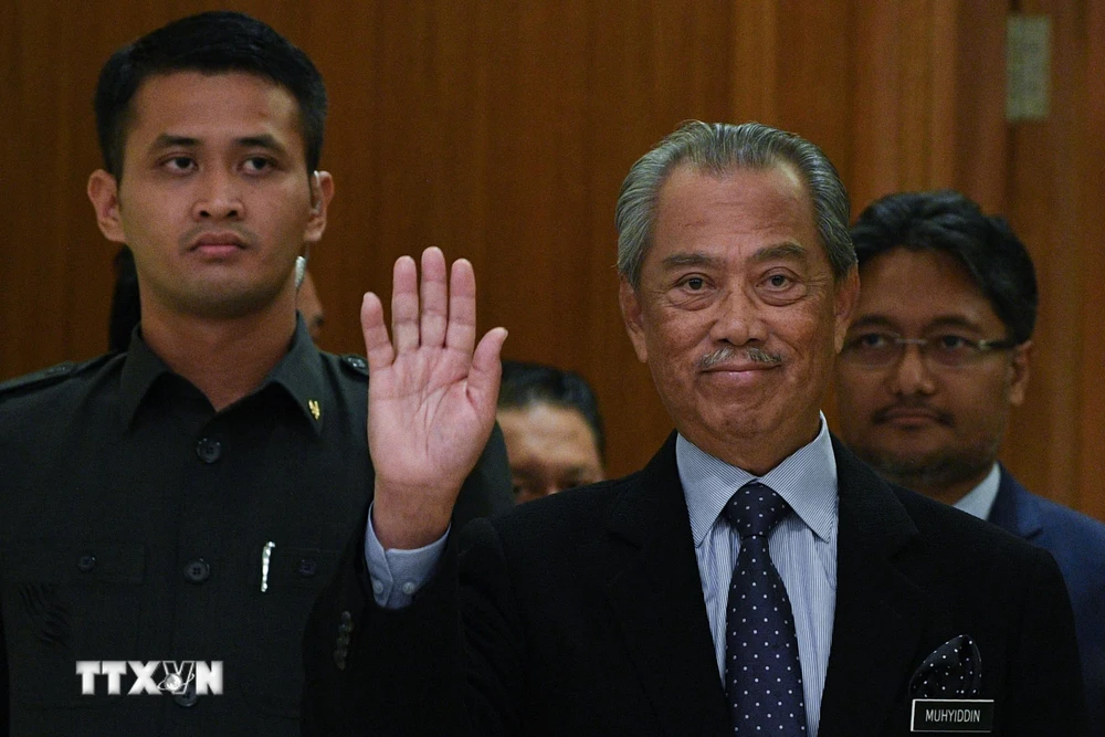 Thủ tướng Malaysia Muhyiddin Yassin (phải) tại một sự kiện ở Putrajaya ngày 9/3/2020. (Ảnh: AFP/ TTXVN)