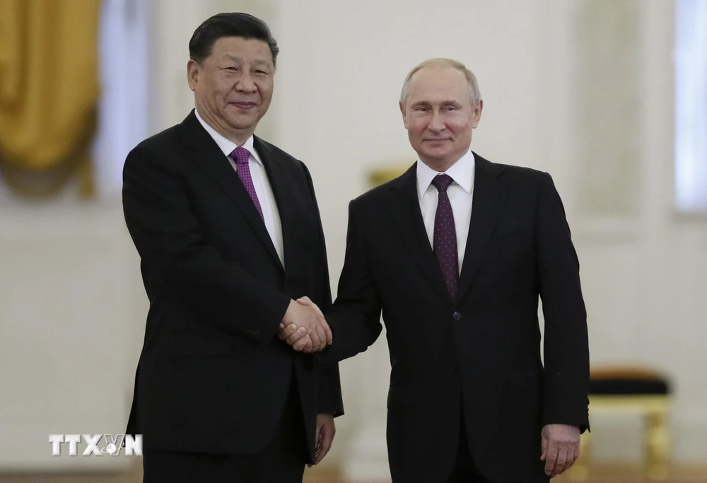 Chủ tịch Trung Quốc Tập Cận Bình (trái) và Tổng thống Nga Vladimir Putin (phải) tại cuộc gặp ở Moskva, Nga ngày 5/6/2019. (Ảnh: AFP/TTXVN)