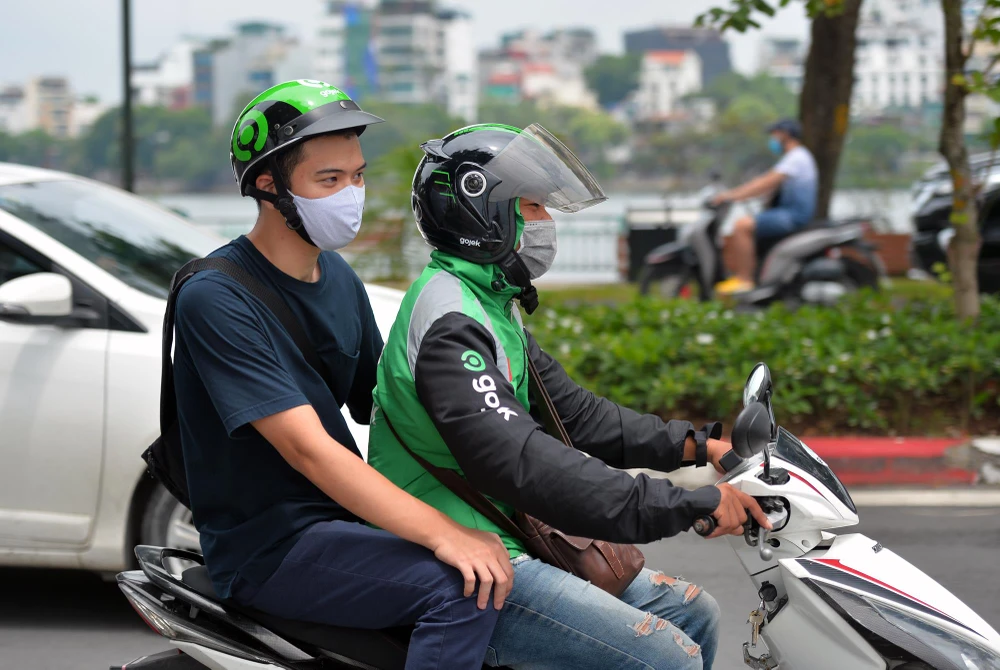 Tài xế công nghệ hào hứng với công việc. (Ảnh: CTV/Vietnam+)