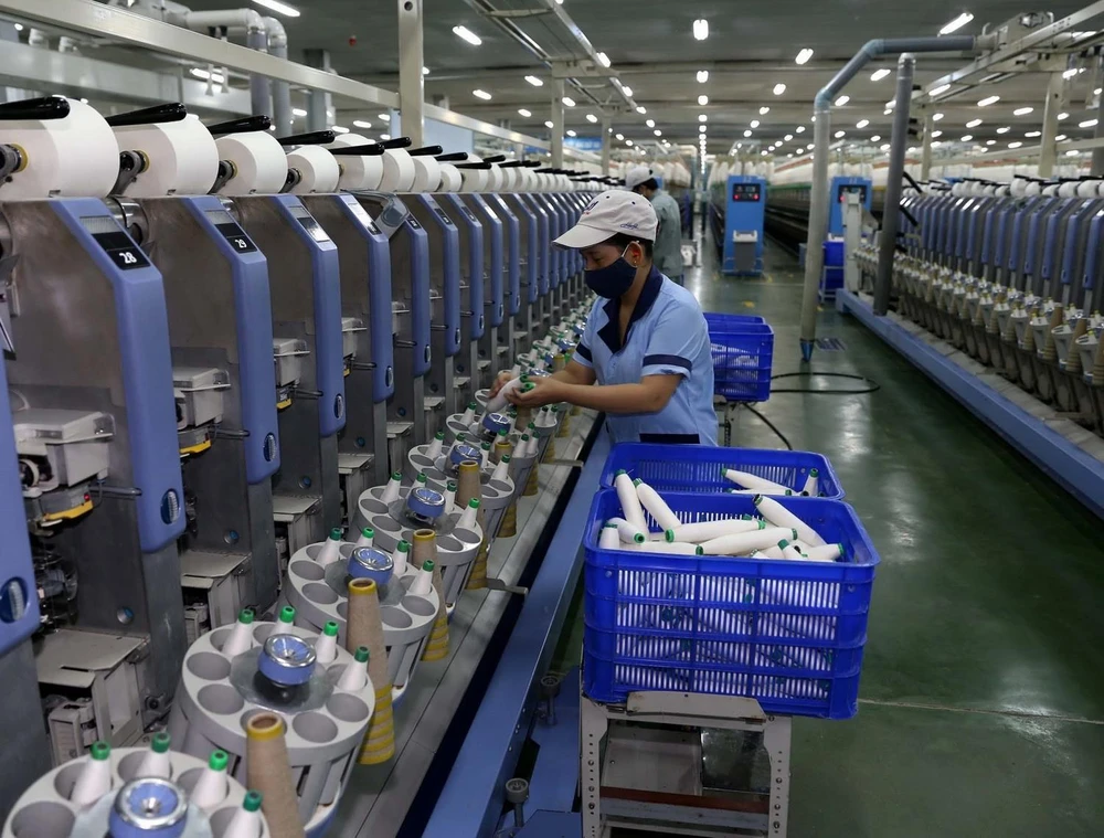 Dây chuyền sản xuất sợi tại nhà máy của Công ty Cổ phần Dệt sợi Đam San. (Ảnh: Vũ Sinh/TTXVN)