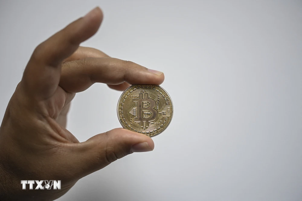 Đồng tiền kỹ thuật số Bitcoin. (Ảnh: AFP/TTXVN)