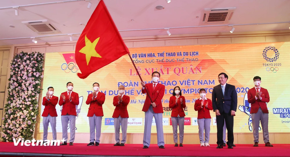 Lễ xuất quân Đoàn Thể thao Việt Nam tham dự Thế vận hội Olympic Tokyo tại Hà Nội diễn ra vào tối 13/7. (Ảnh: PV/Vietnam+) 
