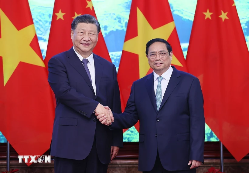 Thủ tướng Phạm Minh Chính và Tổng Bí thư, Chủ tịch nước Trung Quốc Tập Cận Bình chụp ảnh chung. (Ảnh: Dương Giang/TTXVN)
