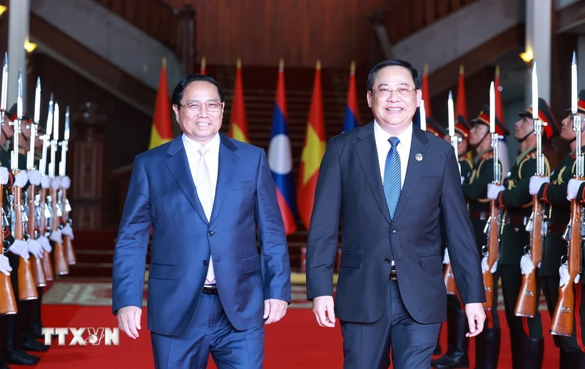 Thủ tướng Phạm Minh Chính hội kiến Thủ tướng Lào Sonexay Siphandone, Chủ tịch ASEAN 2024. (Ảnh: Dương Giang/TTXVN)